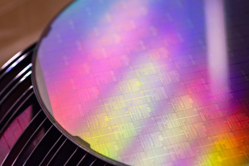 Silicon wafer with integrated circuits and devices.