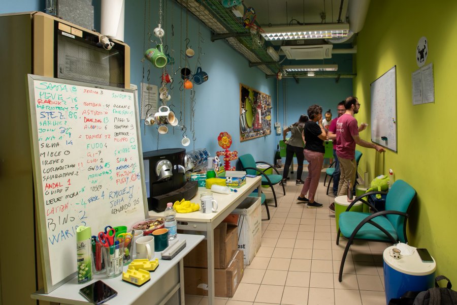 A group of NECSTLab students in the break room.