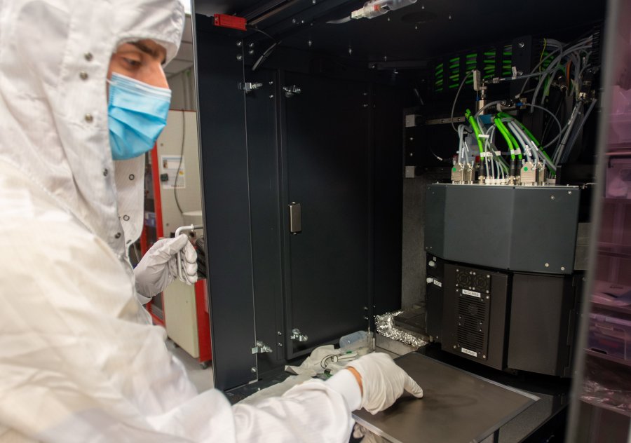 A PhD candidate working with a state-of-the art inkjet and aerosol jet printer installed at Polifab, employed for the deposition of functional inks and the realization of innovative electronic devices. A PhD candidate working with a state-of-the art inkjet and aerosol jet printer installed at Polifab, employed for the deposition of functional inks and the realization of innovative electronic devices.