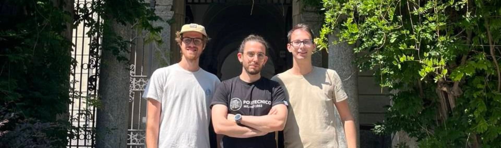 Three men standing in front a building. Three men standing in front a building.